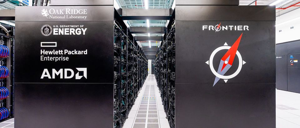 Rows of cabinets in the Frontier supercomputer hall at Oak Ridge National Laboratory